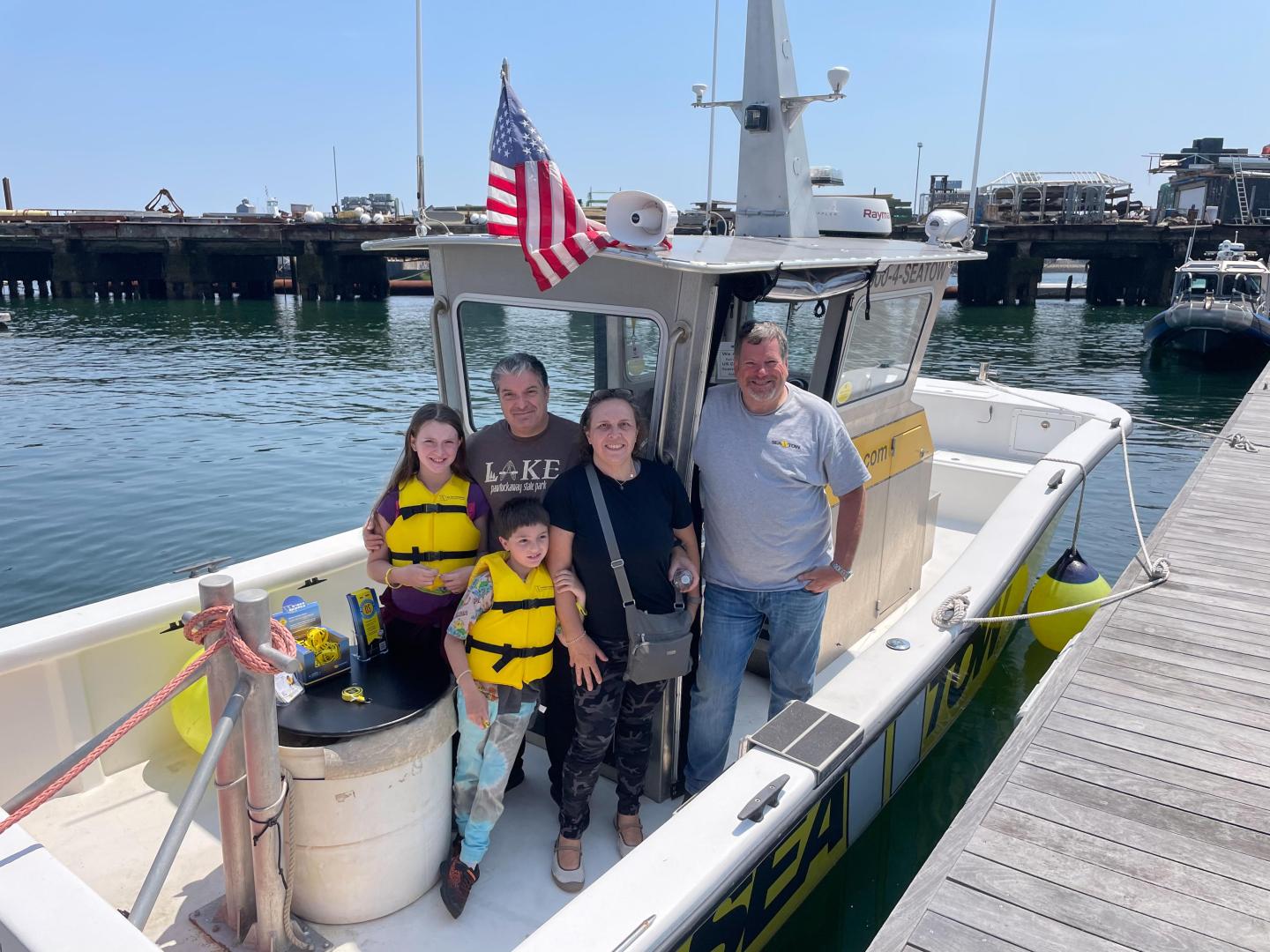 Family aboard the Sea Tow boat during Kids in Boating Day