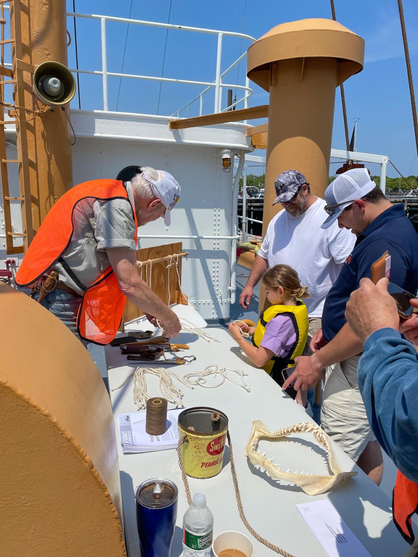 Knot tying lesson aboard the Nantucket Lightship at Kids in Boating Day