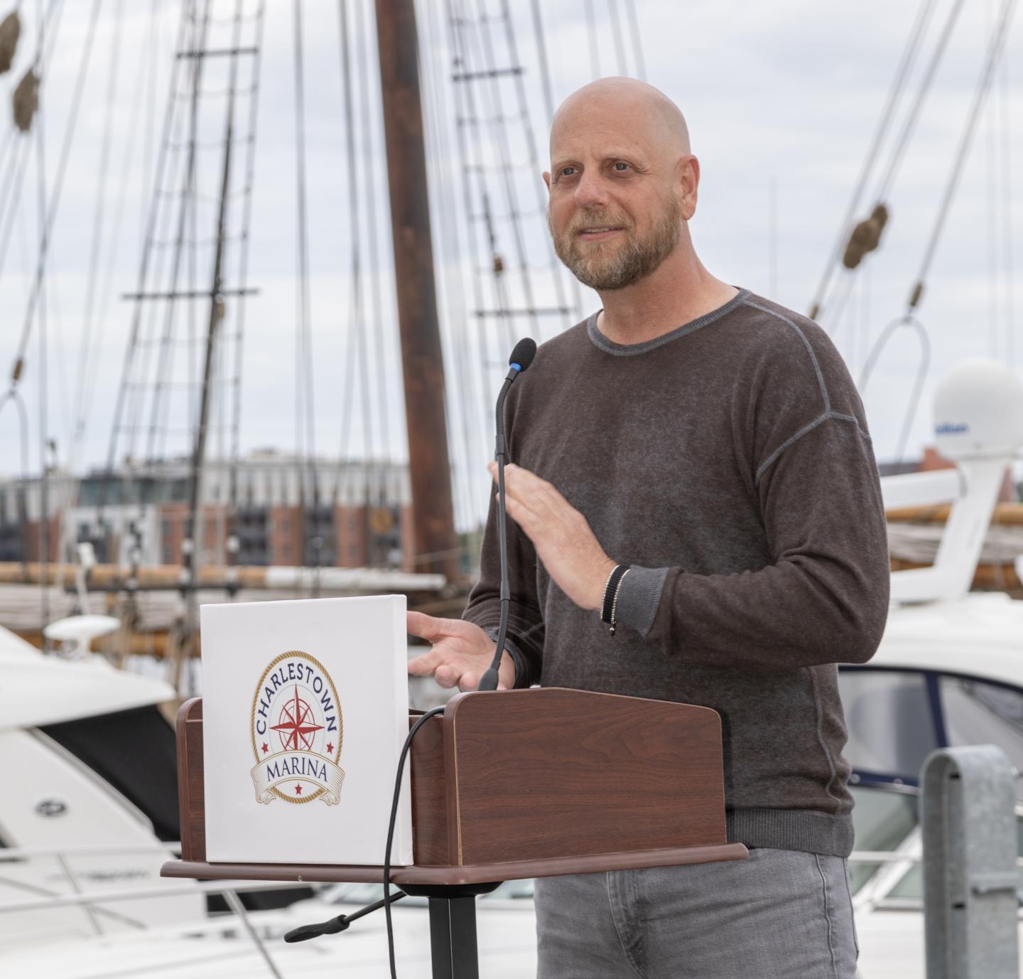 Radio personality and Charlestown resident Karson Tager emcees the event