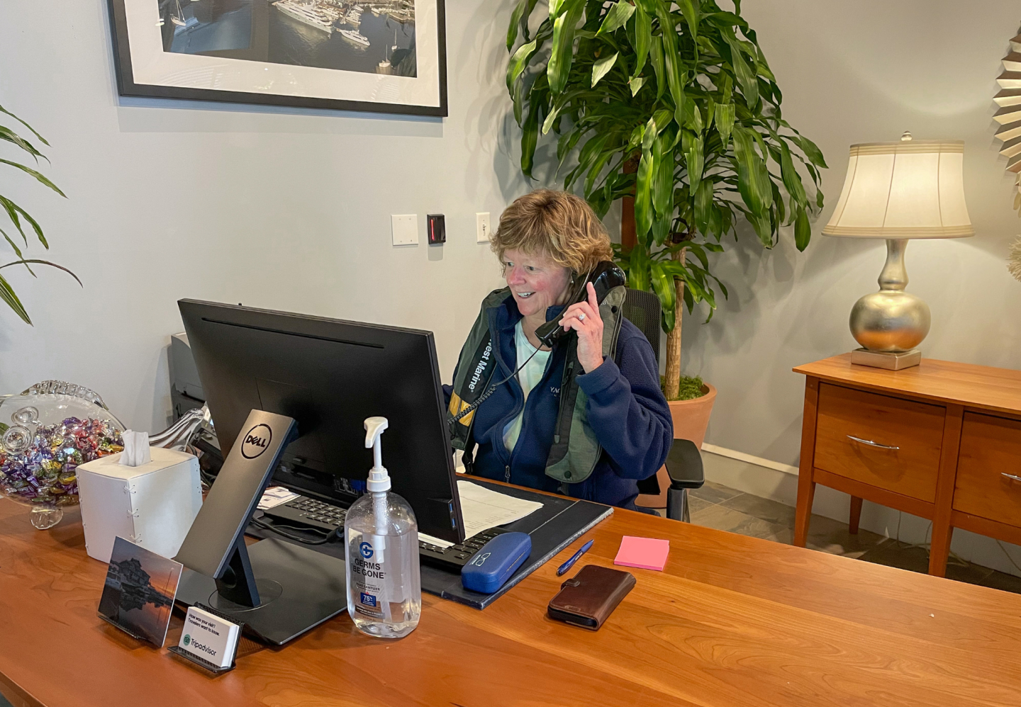 Boston Yacht Haven staff wearing a life jacket at work in recognition of Safe Boating Week
