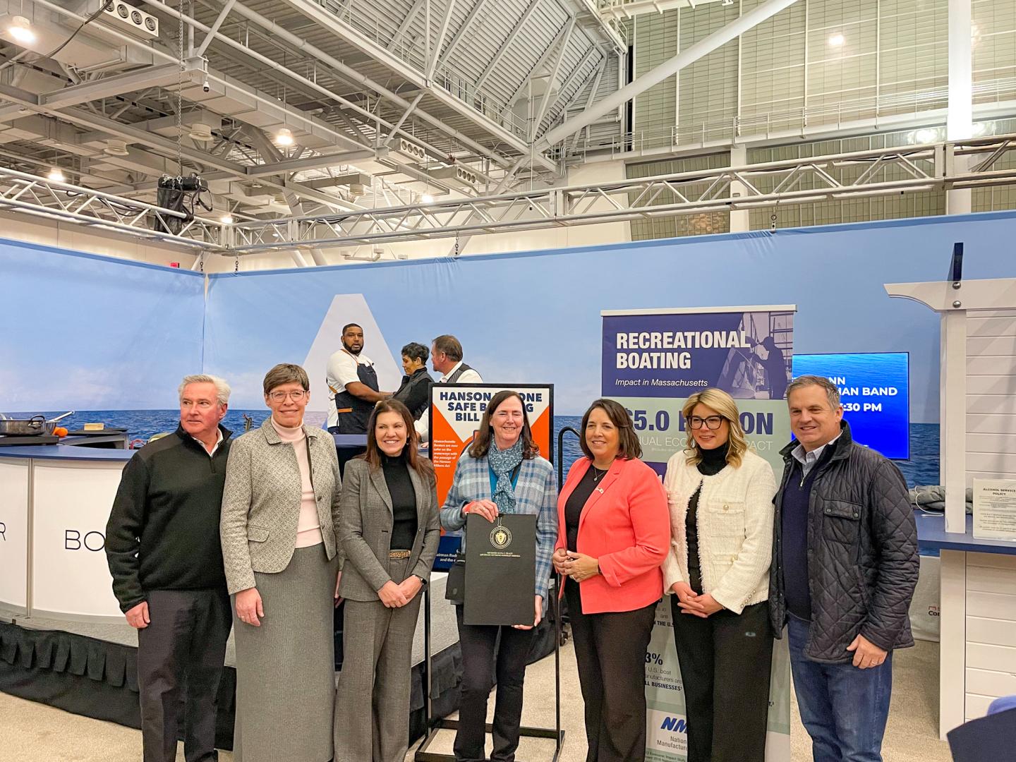 Massachusetts Lieutenant Governor Kim Driscoll presents the signed Hanson Milone Act at the 2025 New England Boat Show